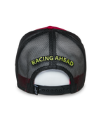 Alpinestars Exceed Trucker Hat, Rear View, Red and Black, features yellow "RACING AHEAD" embroidery on black mesh, adjustable snapback closure, casual sportswear headwear