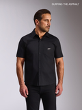 Alpinestars Strive Woven Shirt, short-sleeve button-front casual shirt worn by a male model, black stretch poplin, featuring a chest pocket with a white Alpinestars logo