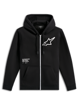 Alpinestars Transverse Hoodie, zwart fleecevest met rits aan de voorkant, voorzien van een witte rits, groot wit Astars-logo op de borst, 'One Goal, One Vision' tekstprint, capuchon met trekkoord en geribde boorden, casual motorsport streetwear