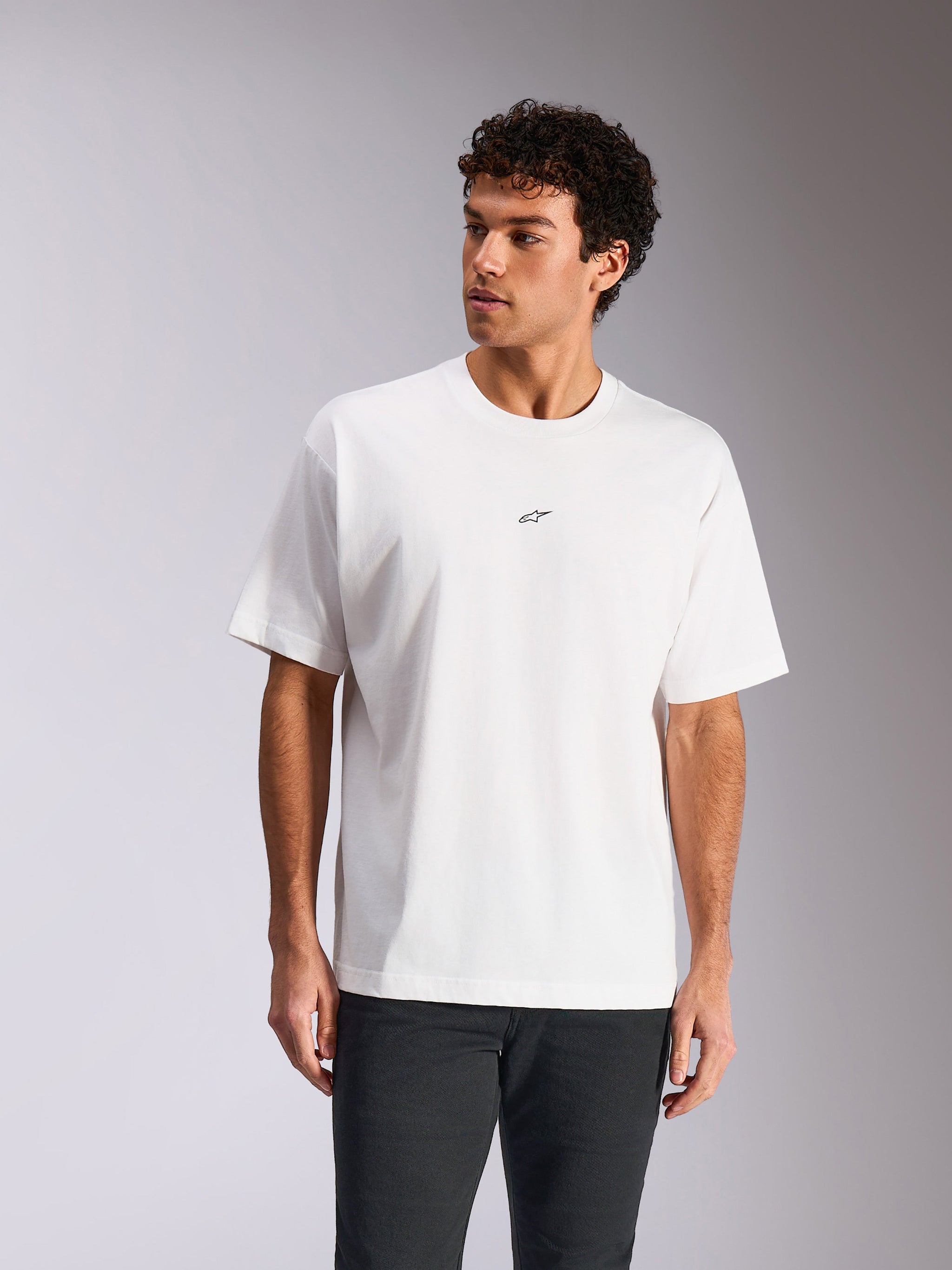Alpinestars Focused Oversized CSF Tee, Short Sleeve T-Shirt, White, small black Astars logo on chest, relaxed fit worn by model, casual motorsport streetwear