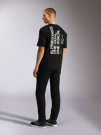 Alpinestars One Oversized CSF Tee, Short Sleeve T-Shirt, Black, back view with vertical white 'ALPINESTARS ONE GOAL. ONE VISION.' graphic, oversized fit, casual motorsport-inspired streetwear