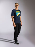 Alpinestars Noka CSF Tee, Short Sleeve T-Shirt, Navy, Yellow Astars Logo with Blue MX Gradation Graphic, Male model wearing navy tee with black pants and sneakers, Casual Motorsport Streetwear