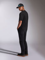 Alpinestars Ellipsoid CSF Tee, Short Sleeve T-Shirt, Black, back view on model wearing black pants and a black Alpinestars cap, casual motorsport lifestyle outfit
