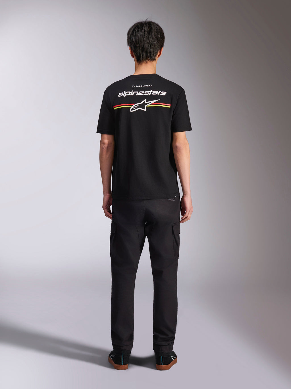 Alpinestars Lanes CSF Tee, Short Sleeve T-Shirt, Black, Back View with White Alpinestars Logo and Red and Yellow Stripes, Casual Motorsport Streetwear