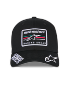 Alpinestars Surpass Hat, Black structured baseball cap, curved bill with white embroidered Astars logo and 'Alpinestars Protects' text, front 'Racing Ahead' logo patch with multi-colored stripes, casual motorsport-inspired headwear