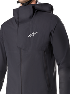 Alpinestars A-Dura Elite Waterdichte Jas, MTB-fietsjas, zwart, met een 3-laags waterdicht membraan, capuchon die over de helm past, zakken met ritssluiting en technische ripstop-textuur voor mountainbike trailrijden