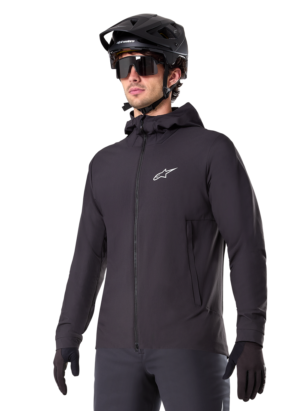 Alpinestars A-Dura Thermal Jacket, Black Cycling Jacket, hooded design with front zipper, white star logo on chest, worn with black mountain bike helmet and gloves, sporty performance gear for cold weather trail riding