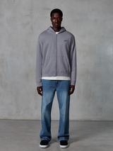 Alpinestars Essentials Ageless Zip Hoodie, Silver, casual streetwear, full-zip fleece with small black Alpinestars logo on chest, worn with blue jeans and white undershirt, relaxed fit motorsport-inspired design