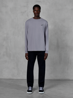 Alpinestars Essentials Ageless LS Tee, Long Sleeve T-Shirt, Silver, small black Alpinestars logo on the chest, organic cotton jersey with stone wash finish, worn by a model with black pants and sneakers, casual streetwear