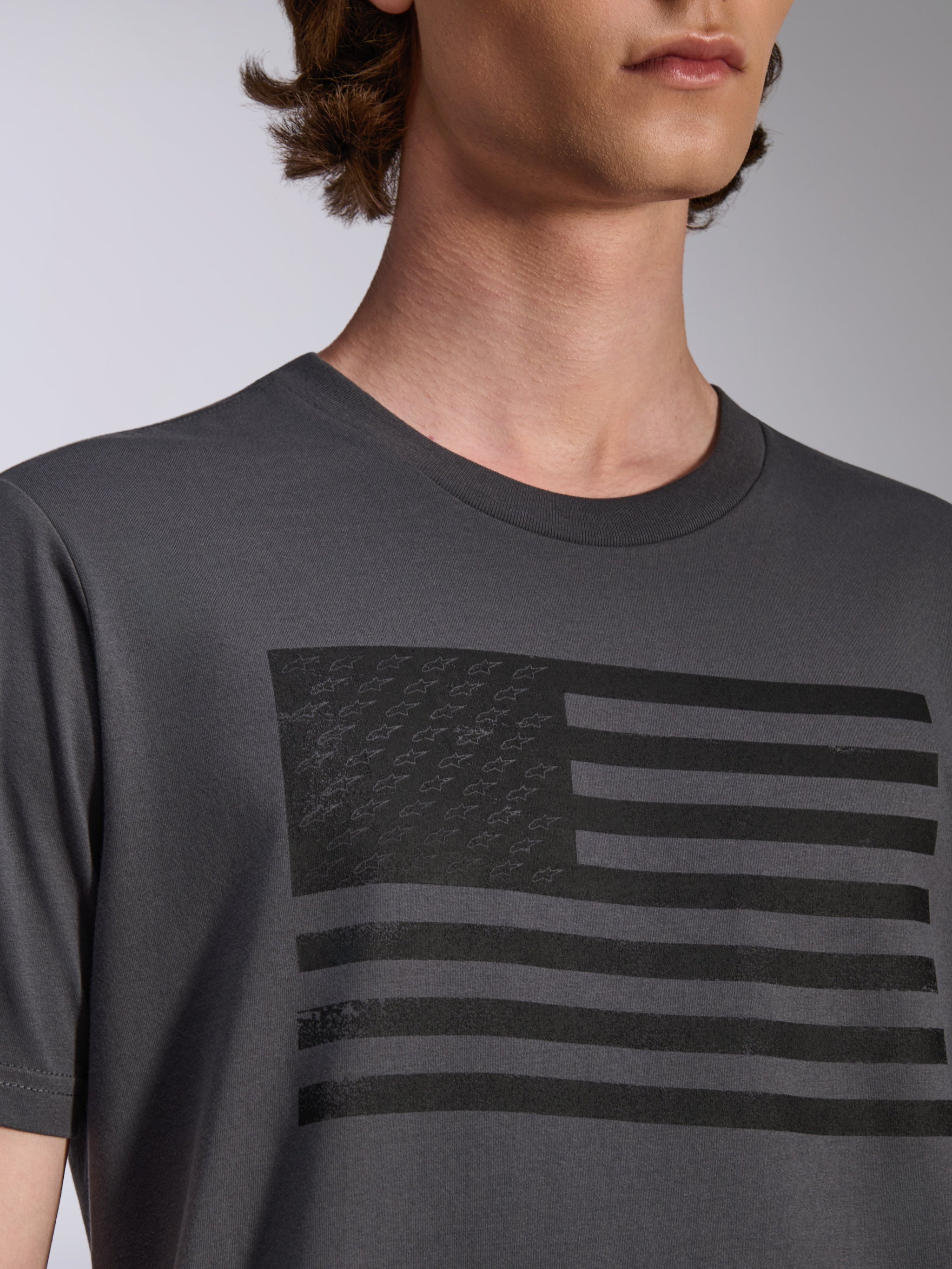 Alpinestars Waving CSF Tee, Short Sleeve T-Shirt, Charcoal, featuring a black flag graphic with star logos on the chest, casual motorsport streetwear