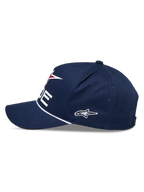 Alpinestars Ride Comp Snapback Pet, marineblauw, wit en rood, zijaanzicht, gestructureerde kroon met gebogen klep, witte gevlochten koordafwerking, geborduurd zijlogo, casual motorsport pet