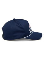 Alpinestars Ride Comp Snapback pet, marineblauw met witte en rode accenten, zijprofiel met gebogen klep en witte gevlochten koordafwerking, gestructureerde kroon, casual motorsportpet