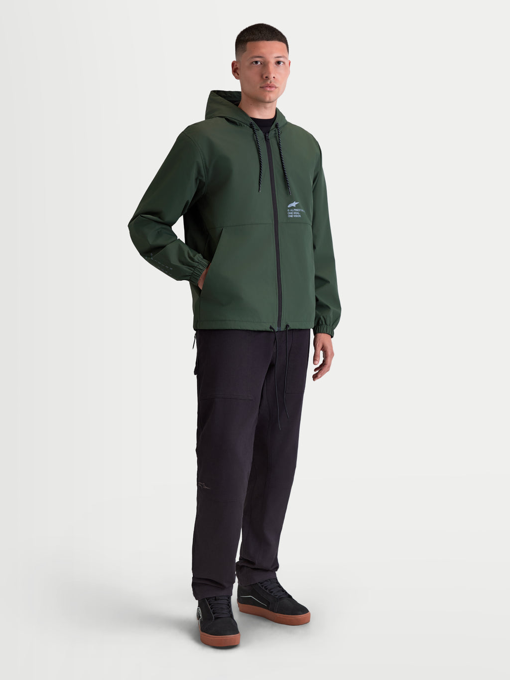 Alpinestars Speeder Resolve windbreaker jas, heren-windbreaker voor urban gebruik, groen, lichtgewicht polyester met capuchon en meshvoering, Alpinestars-logo op de borst.