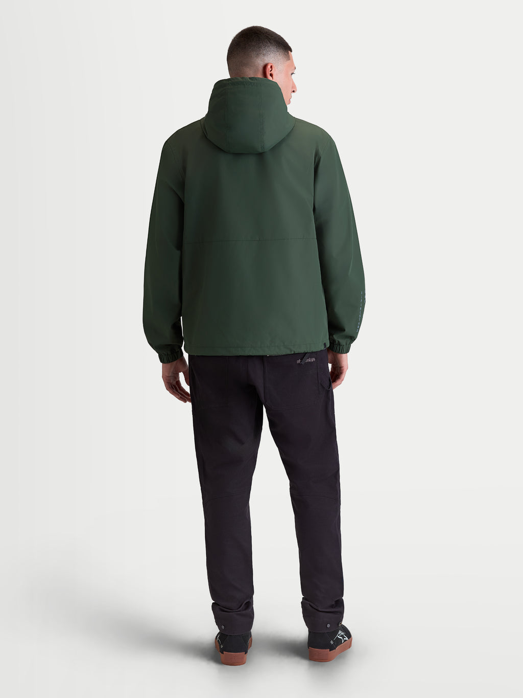 Alpinestars Speeder Resolve windbreaker jas, lichtgewicht heren-sportswear, groen, winddicht textiel, achteraanzicht met capuchon en elastische manchetten.