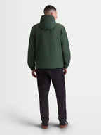 Alpinestars Speeder Resolve windbreaker jas, lichtgewicht heren-sportswear, groen, winddicht textiel, achteraanzicht met capuchon en elastische manchetten.