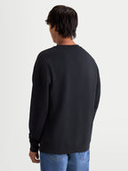 Alpinestars Guise Oversized Crew, heren sportswear fleece pullover, zwart, mix van katoen en gerecycled polyester, achteraanzicht met relaxte oversized pasvorm en geribde zoom.