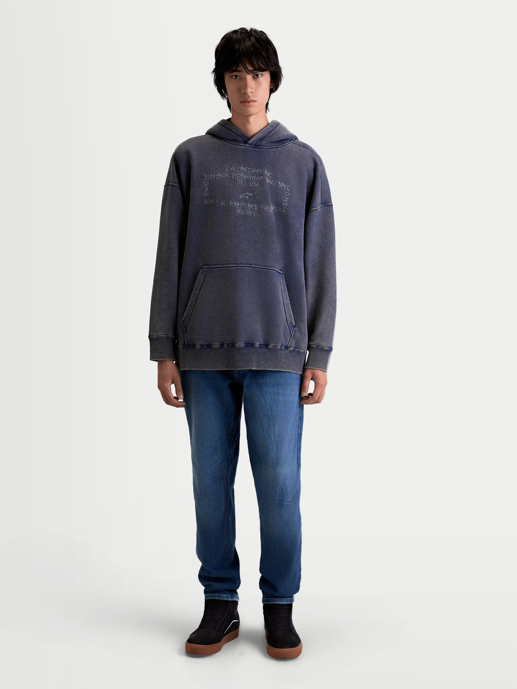 Alpinestars Infinite Washed Oversized Hoodie, Unisex Lifestyle Sportswear Pullover, Washed Navy Blue with a snow-wash finish, featuring a kangaroo pocket and embroidered chest logo, cotton-blend fleece construction.