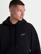 Alpinestars Pioneer Oversized hoodie, zwarte fleece-hoodie met rits voor heren, wit geborduurd logo op de borst, Vislon-voorrits, zelfgevoerde capuchon, oversized pasvorm voor dagelijks casual gebruik.