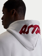 Alpinestars Pioneer Oversized Hoodie, Casual Sportswear Fleece for Men and Women, Cement Gray with Red embroidered logo on the hood, on-model back view highlighting the oversized fit and premium branding.