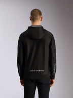 Alpinestars Sessions V3 Hoodie, back view, black zip-up hoodie with grey Alpinestars wordmark on the lower back, Astars branding on sleeves, ribbed hem and cuffs, casual motorsport streetwear