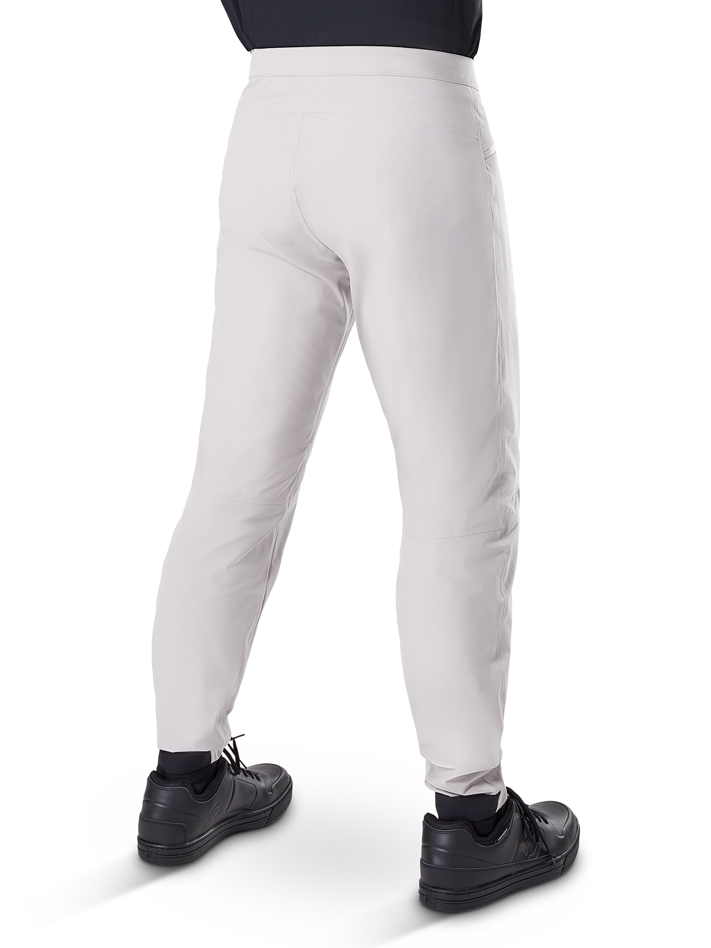 Alpinestars A-Dura Waterproof Pants, MTB Cycling Pants, Titanium Gray, rear view showing tapered legs and elasticated cuffs, worn with black shoes, waterproof technical gear for mountain biking