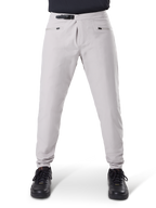 Alpinestars A-Dura Waterproof Pants, MTB Cycling Pants, Titanium Gray, front view, featuring a black ratchet waist closure and dual zippered pockets, elasticated cuffs, worn with black sneakers, technical waterproof gear for mountain biking