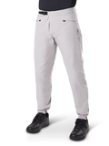 Alpinestars A-Dura Waterproof Pants, Mountain Bike Pants, Titanium Gray, featuring a black ratchet waist closure and zippered hand pockets, tapered legs with elastic cuffs, worn with black shoes, durable 3L waterproof construction for off-road cycling