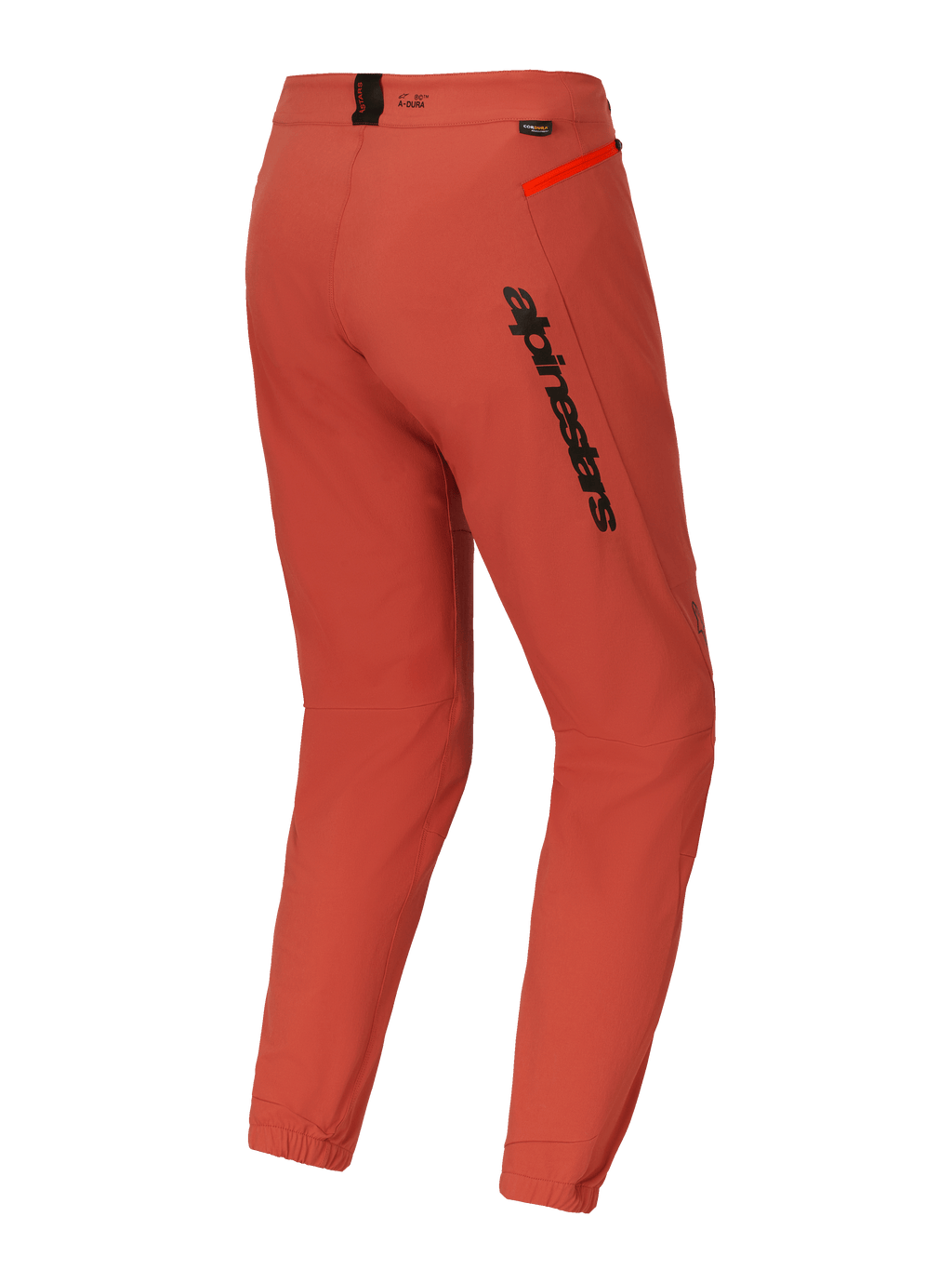 Alpinestars A-Dura Elite broek, mountainbike (MTB) broek, donkeroranje, driekwart achteraanzicht met opvallende zwarte Alpinestars-branding op de dij, feloranje ritsaccent op de heup en elastische enkelmanchetten, technische performance wielerkleding