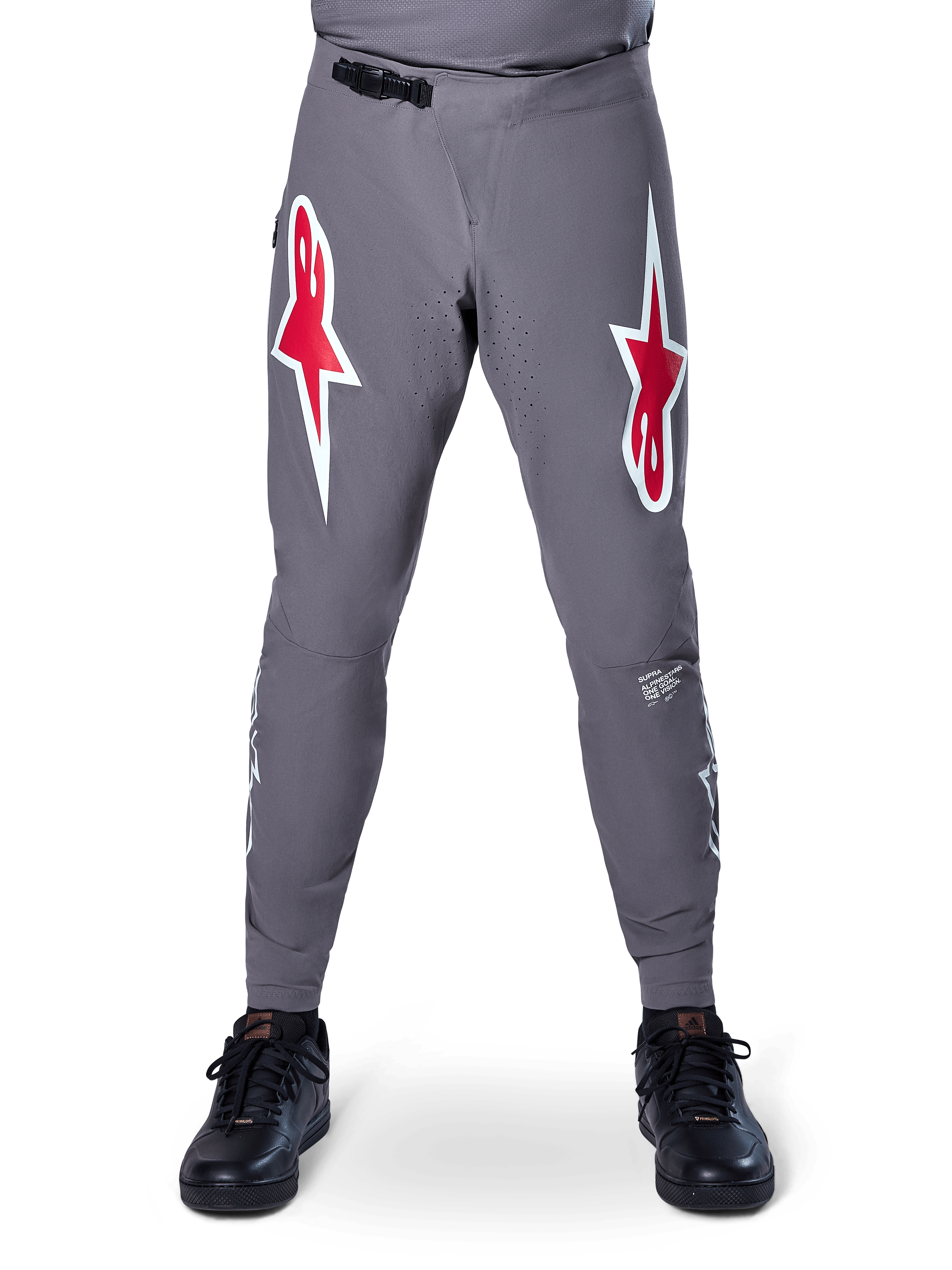 Alpinestars A-Supra Race Pants, MTB Racing Pants, Dark Gray, featuring large red and white star logos on the thighs, laser-perforated ventilation on inner legs, and a black ratchet waist closure, designed for mountain bike racing.
