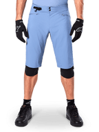 Alpinestars A-Dura Shorts, Infinity Blue mountain bike shorts, worn with black gloves and knee pads, featuring a double snap closure and side waist adjuster, performance cycling gear for MTB