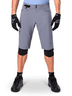 Alpinestars A-Dura Shorts, Mountain Bike Shorts, Dark Gray, worn with black Alpinestars gloves and knee pads, featuring double snap closure and zippered mesh-lined pockets, durable 2-way stretch fabric for off-road cycling
