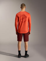 Oranje A-Dura Air LS Jersey en bordeauxrode Ride shorts, achteraanzicht van technische Alpinestars MTB-kleding.