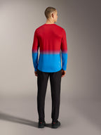Alpinestars A-Dura ASTARS 2.0 MTB-jersey met lange mouwen, rood en blauw kleurverloop, rugaanzicht op model.