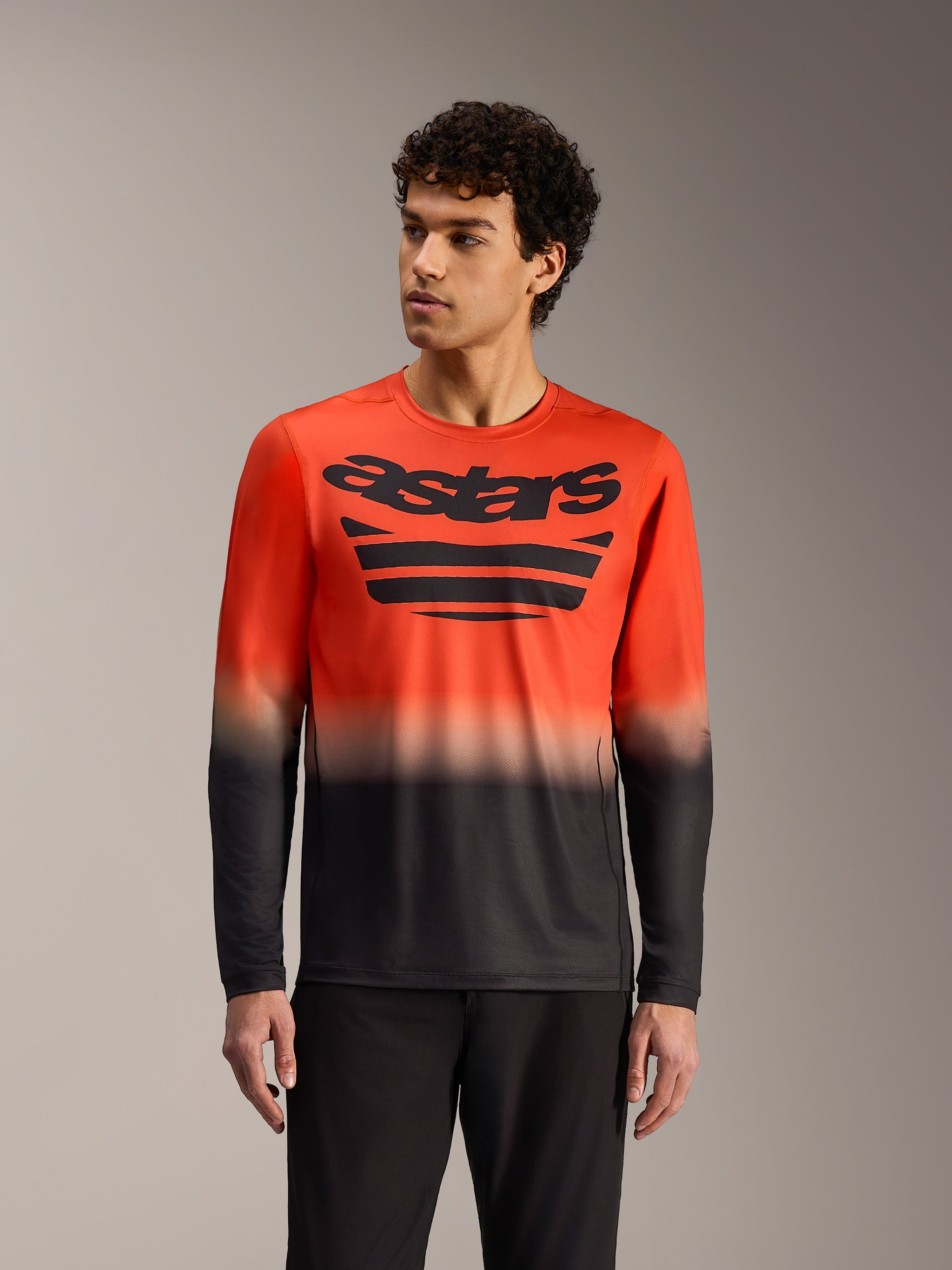 A-Dura ASTARS 2.0 jersey met lange mouwen in oranje-zwart kleurverloop, met opvallende MTB-graphics op de borst.