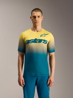 A-Dura ASTARS Jersey 2.0 MTB-shirt met korte mouwen, blauwgroen naar geel fluo kleurverloop en opvallend borstlogo.