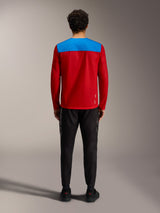 Alpinestars A-Dura Elite 2.0 MTB-trui, rood en blauw achteraanzicht, lange mouwen, met zwarte performance broek.