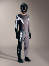 A-Supra Elite MTB racing kit in Faded Gray, featuring performance pants with a bold white wordmark and matching jersey.