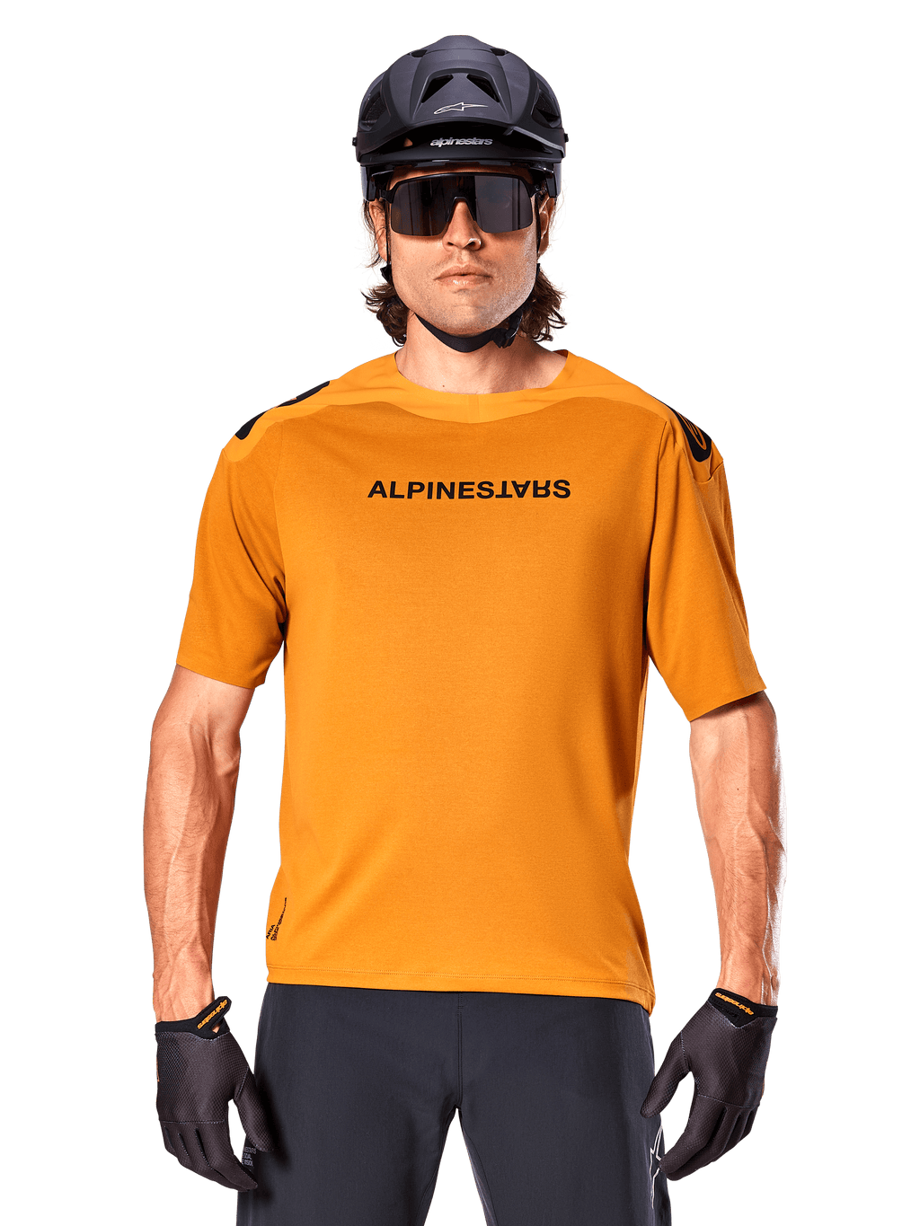 Alpinestars A-Aria Polartec Switch Jersey - Short Sleeve, Dark Gold, mountain bike rider wearing black helmet and sunglasses, performance cycling apparel for MTB trails