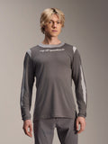 Alpinestars A-Dura Dri Wool Jersey Long Sleeve, Dark Gray, worn by male model, featuring light gray mesh panels on shoulders and sleeves, white wordmark logo on chest, performance mountain bike gear