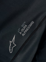 Zwarte Stella A-Dura Ride Jersey close-up met technische jacquard stof en A-DURA ALPINESTARS en Astars logo's.