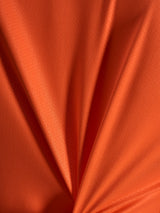 Oranje jacquardstof detail van de Alpinestars Stella A-Dura Ride Jersey met een lichtgewicht en rekbare textuur.