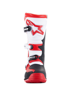 Alpinestars Tech-T laarzen, triallaarzen, felrood, zwart en wit, vooraanzicht met een ergonomische witte scheenplaat met een rood sterlogo, sluitingssysteem met drie gespen en een robuuste zwart-rode neus, ontworpen voor off-road trialrijden