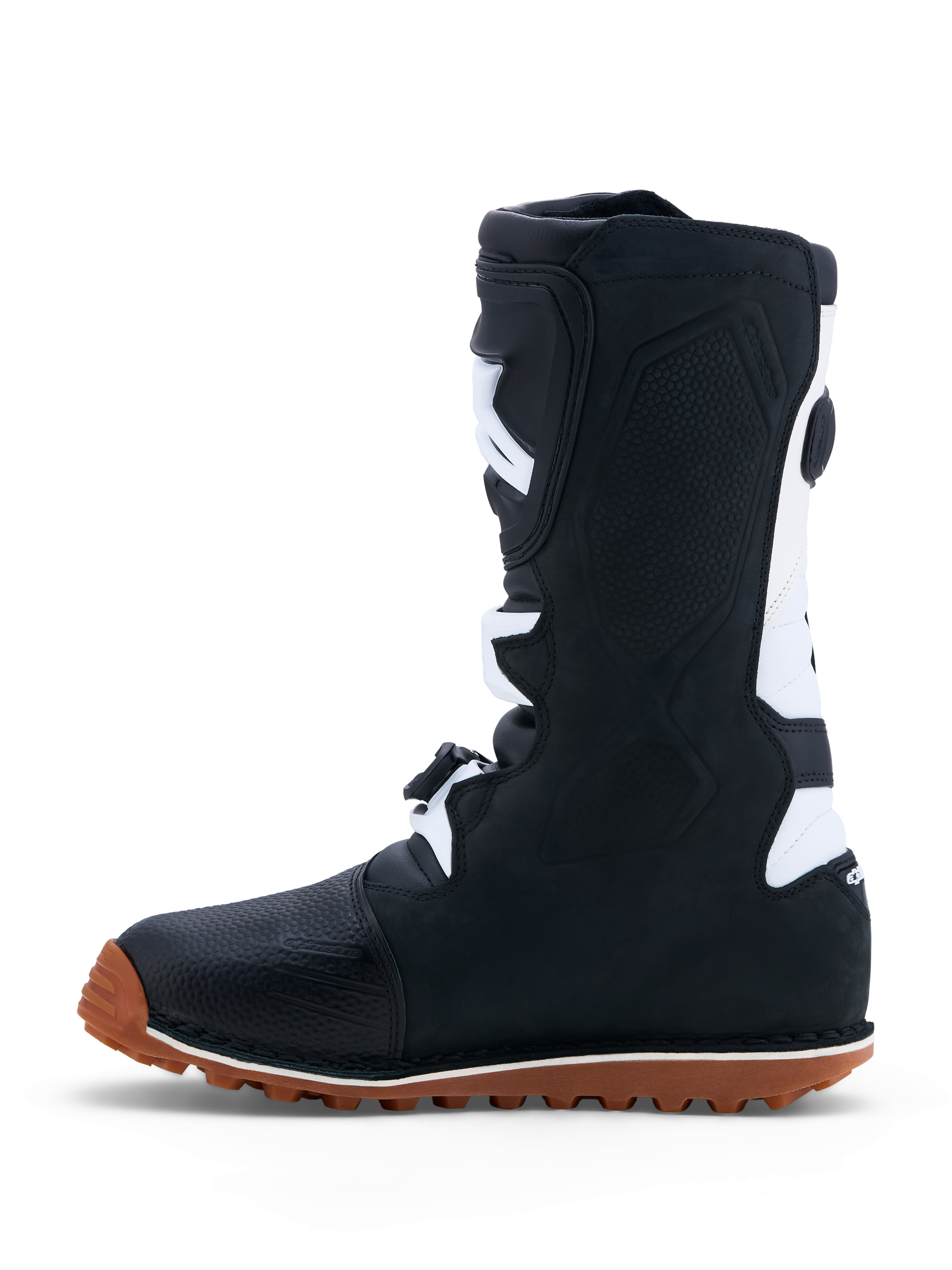 Alpinestars Tech-T laarzen, zwart-witte trialmotorlaarzen van leer met een bruine gumzool en CE-gecertificeerde bescherming.