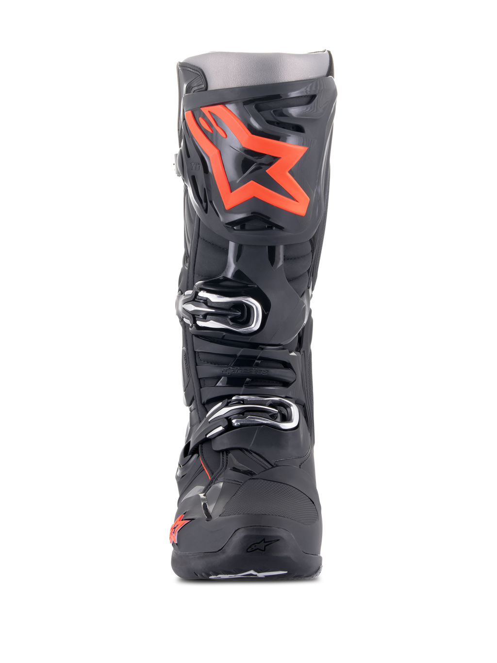 Alpinestars Tech 10 laarzen, motorcrosslaarzen, zwart en fluorood, vooraanzicht, met een groot fluorescerend rood sterlogo op de scheenplaat, zilveren gespen en een duurzaam zwart TPU-chassis.