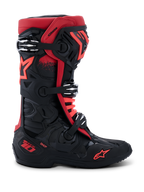 Alpinestars Tech 10 Boots, Motocross Boots, Black and Red, side profile view, three silver aluminum buckles, red star logo on the side and ankle, DHCP technology branding on the heel, reinforced protective chassis for off-road racing.