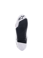 Alpinestars Tech 10 laarzen, motorcrosslaarzen, onderaanzicht met het zwarte vervangbare centrale inzetstuk en witte zool, getextureerd grippatroon, Alpinestars sterlogo op het teengedeelte, duurzaam off-road schoeisel
