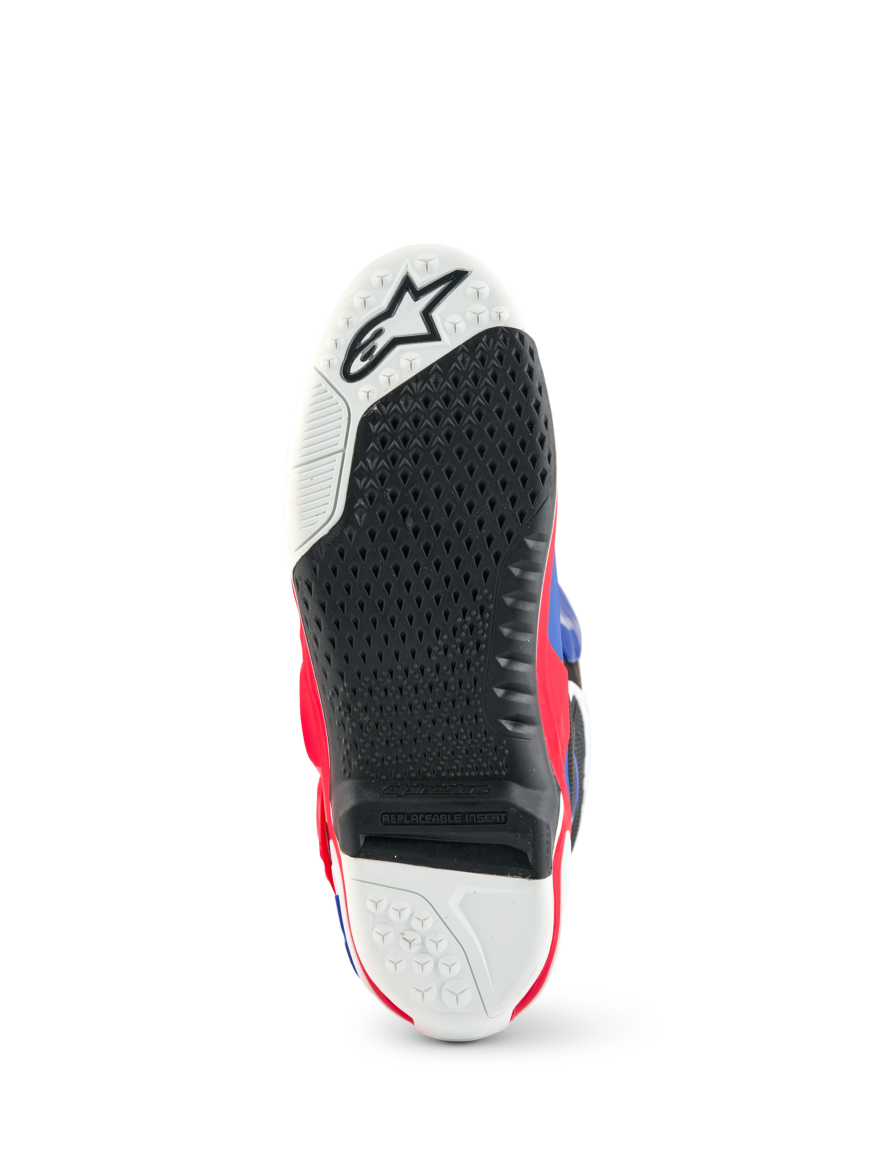 Alpinestars Limited Edition Fortitude Tech 10 laars, onderaanzicht van de zool van de motorcrosslaars, zwart en wit getextureerd grippatroon, vervangbaar centraal inzetstuk, accenten in Bright Red White Blue, duurzame constructie voor off-road prestaties