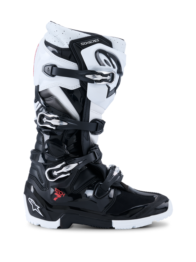 Alpinestars 2026 Tech 7 Enduro Boots, Off-Road Motorcycle Boots, Black and White, featuring four metallic buckles, high-impact TPU protection panels, rugged dual-compound sole, and bold Alpinestars branding on the heel and shin