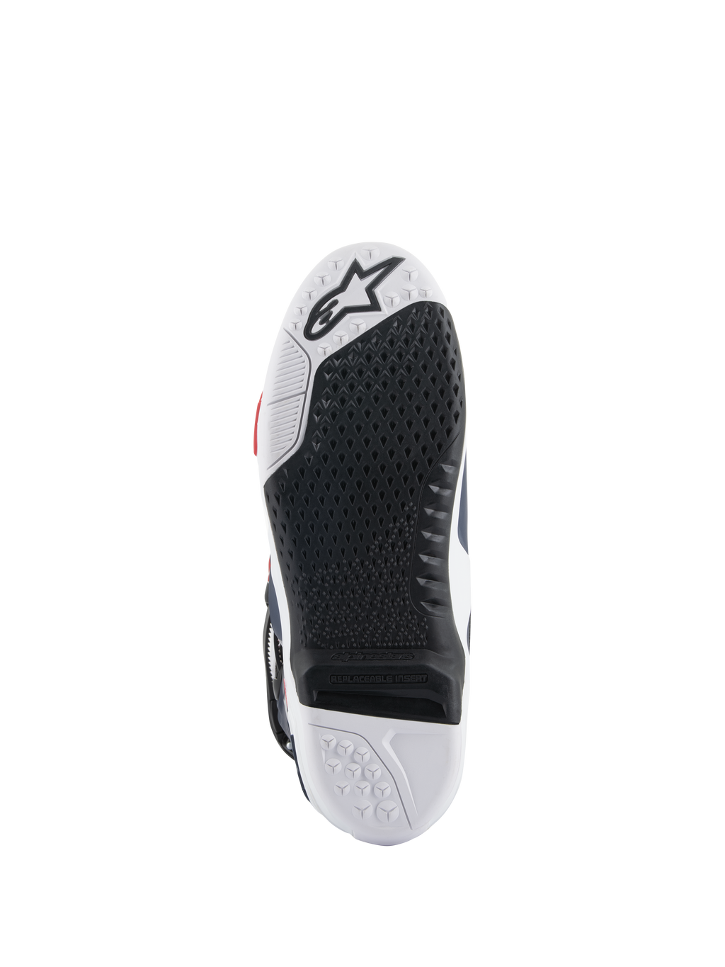 Alpinestars Tech 10 Supervented laarszool, onderaanzicht met een zwart-wit dual-compound ontwerp, honingraat gripstructuur, vervangbaar centraal inzetstuk en Alpinestars-logo in reliëf, geoptimaliseerd voor motorcross voetsteunprestaties.