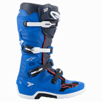 Alpinestars Tech 7 laarzen, motorcrosslaarzen, Alpine Blue, Night Navy en Bright Red, hoog model met een sluitsysteem met vier gespen, witte en zwarte gespen, witte zool met zwart middengedeelte, rode biezen en Alpinestars-branding, professionele off-road racebescherming.